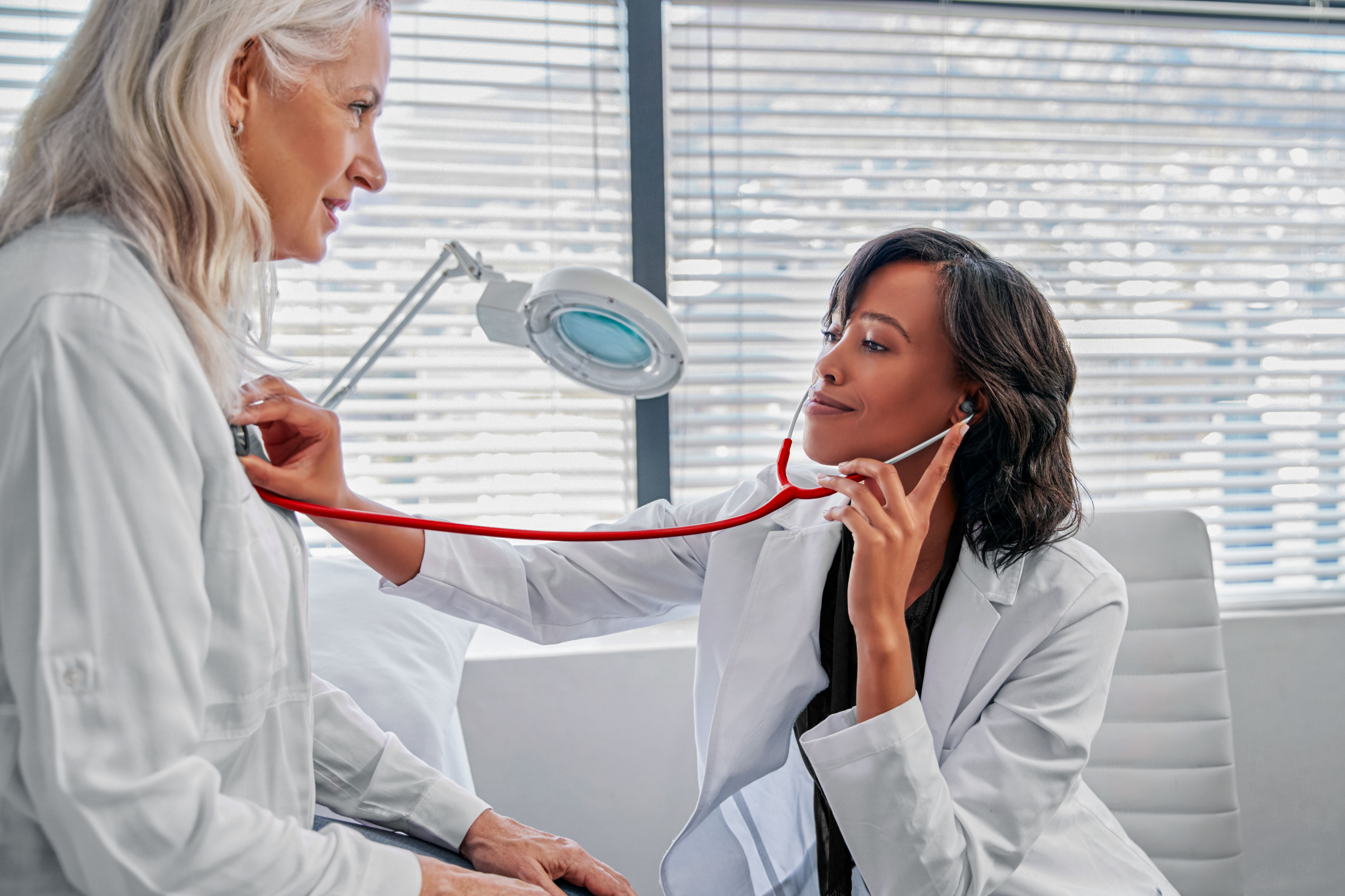 woman-patient-having-medical-exam-with-female-JKLS94B